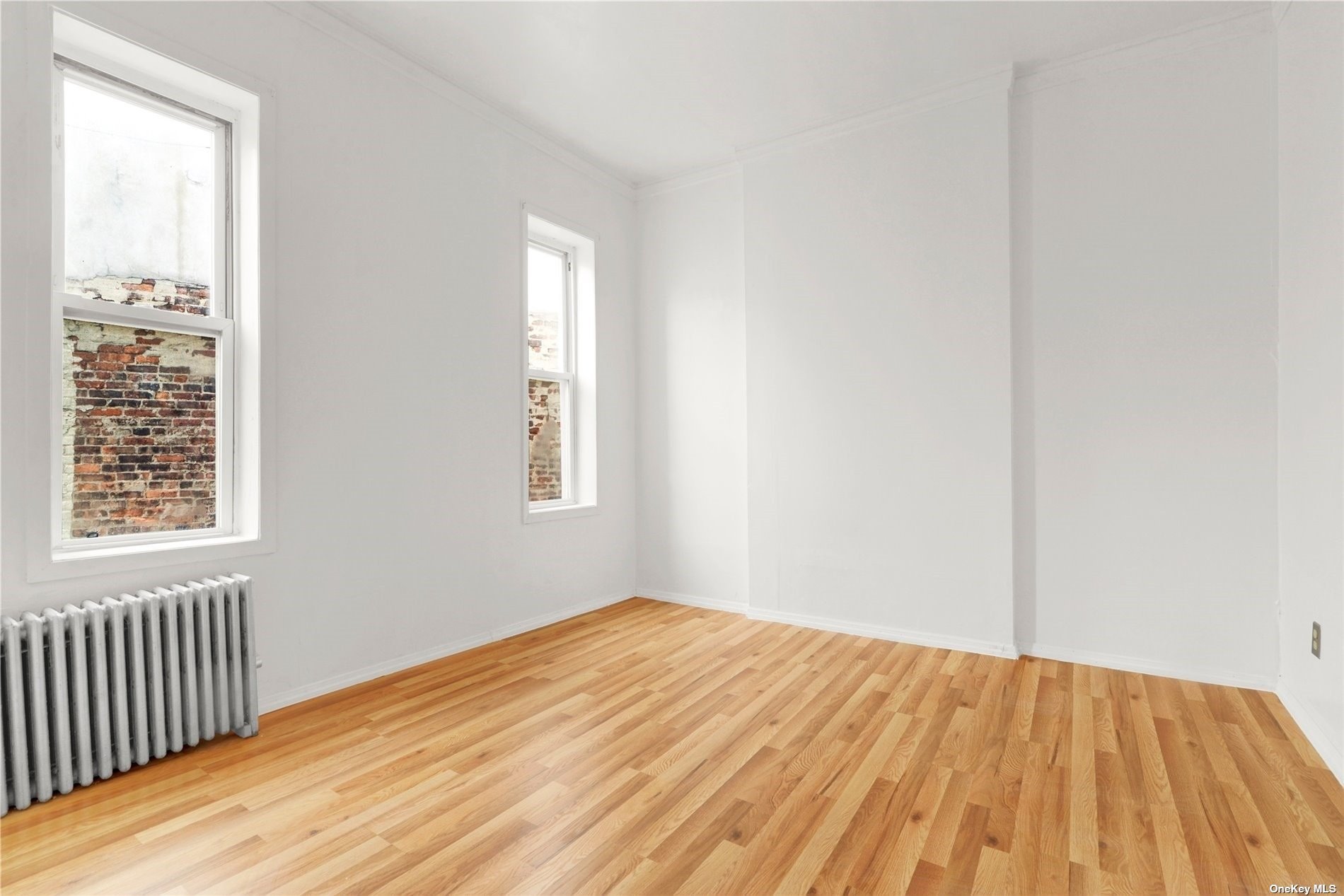 695 Meeker Avenue, Unit 6 Brooklyn, NY 11222 - Photo 7 of 17 a view of empty room with wooden floor and fan