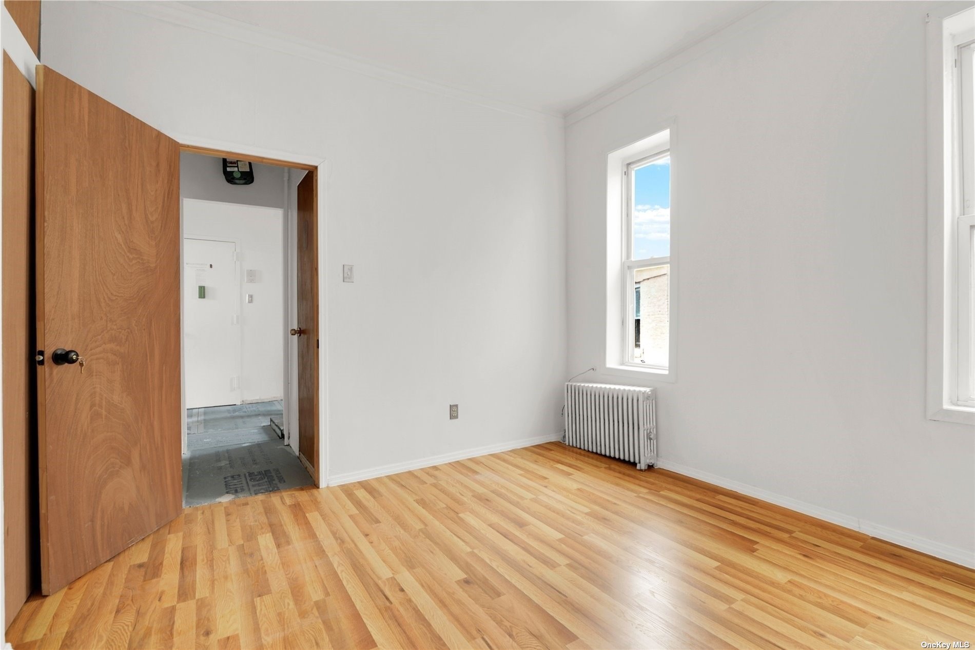 695 Meeker Avenue, Unit 6 Brooklyn, NY 11222 - Photo 8 of 17 a view of empty room with wooden floor and fan
