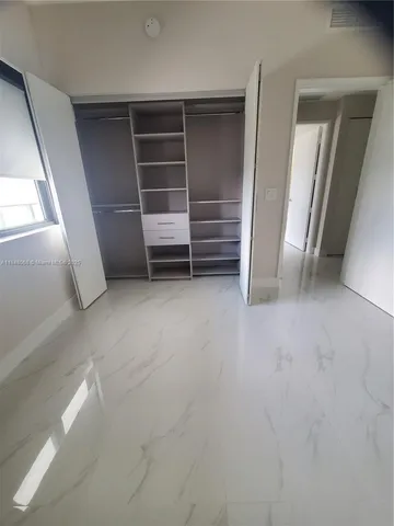 a bathroom with a toilet tub and a shower