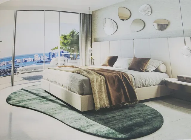 an aerial view of a swimming pool a yard and outdoor seating