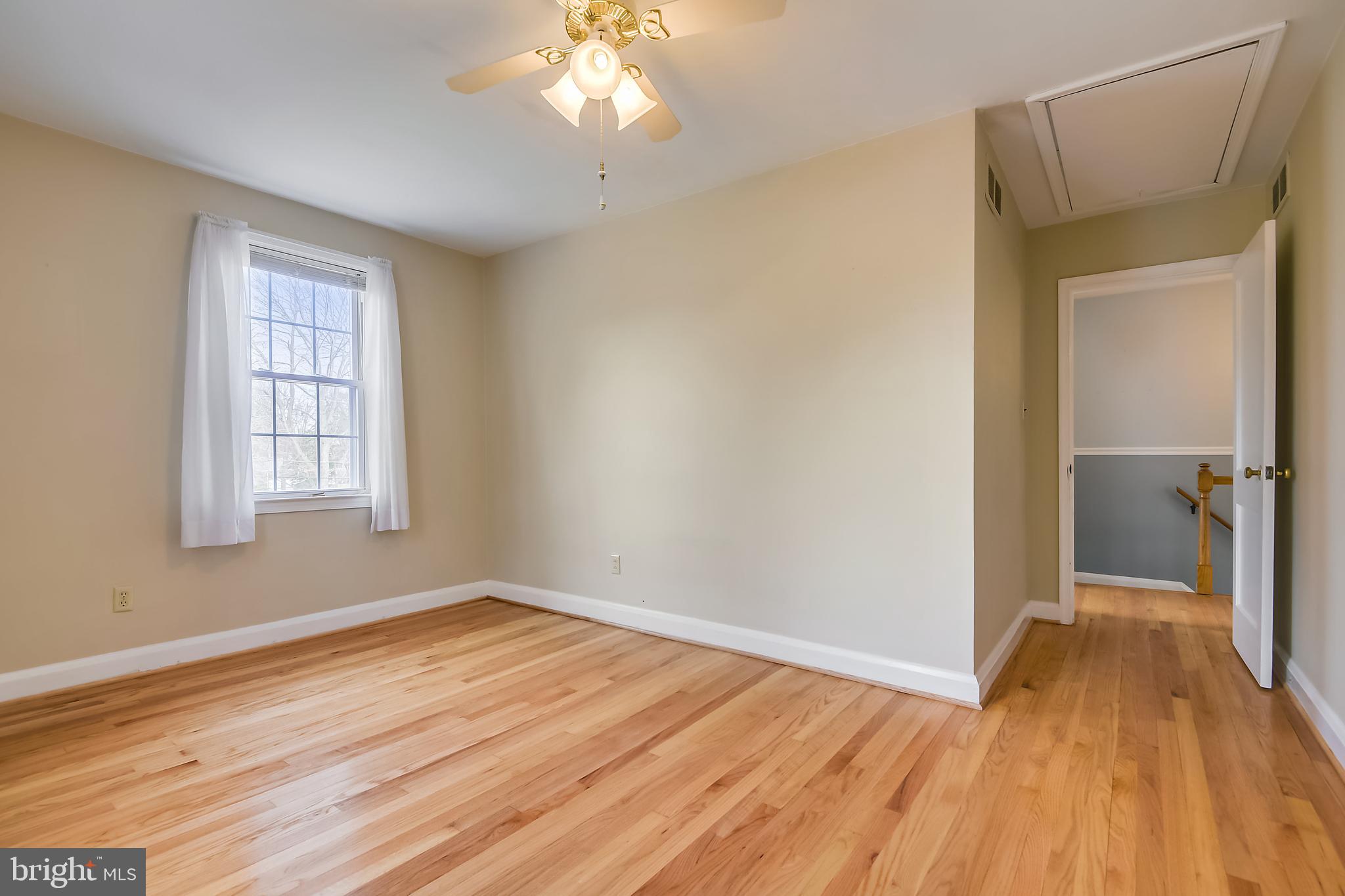 1622 Myamby Road Baltimore, MD 21286 - Photo 15 of 28 wooden floor in an empty room with a window