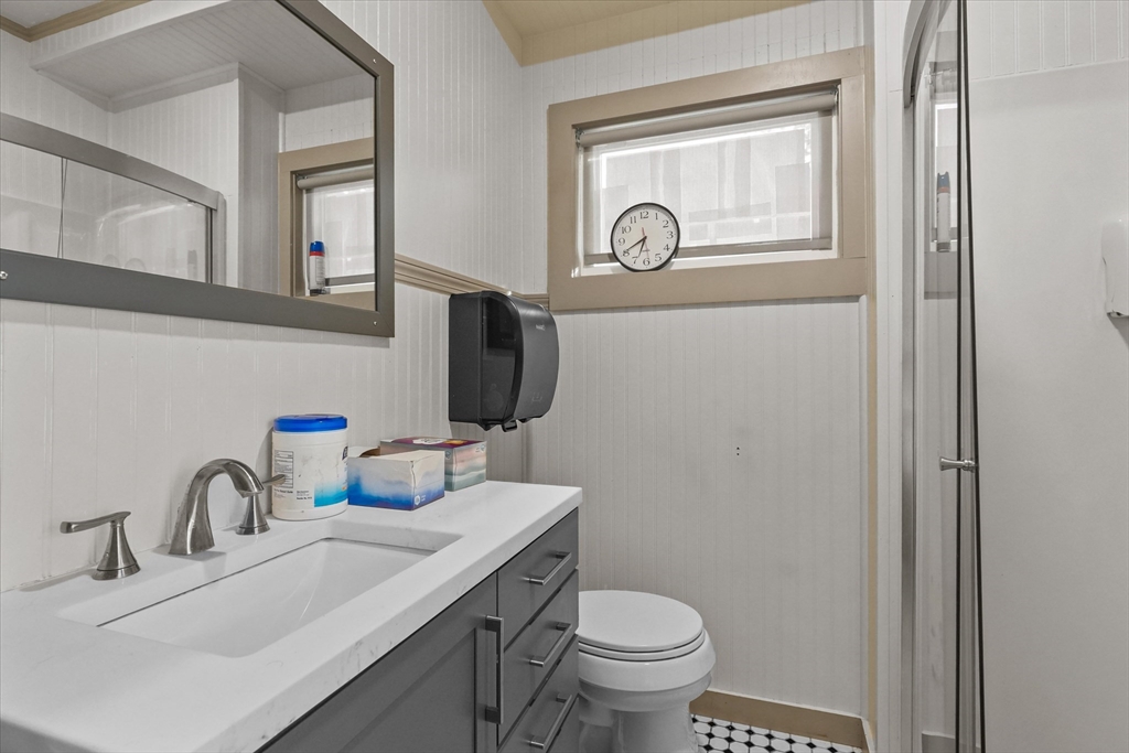 37-39 South Main Street Millbury, MA 01527 - Photo 16 of 42 a bathroom with a toilet sink and mirror