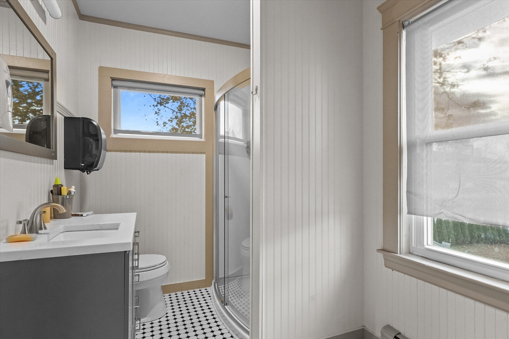 37-39 South Main Street Millbury, MA 01527 - Photo 20 of 42 a bathroom with a toilet a sink and a window