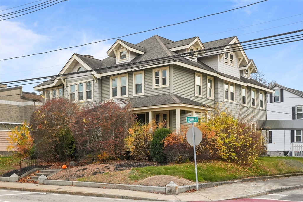 37-39 South Main Street Millbury, MA 01527 - Photo 2 of 42 a view of a white house next to a yard