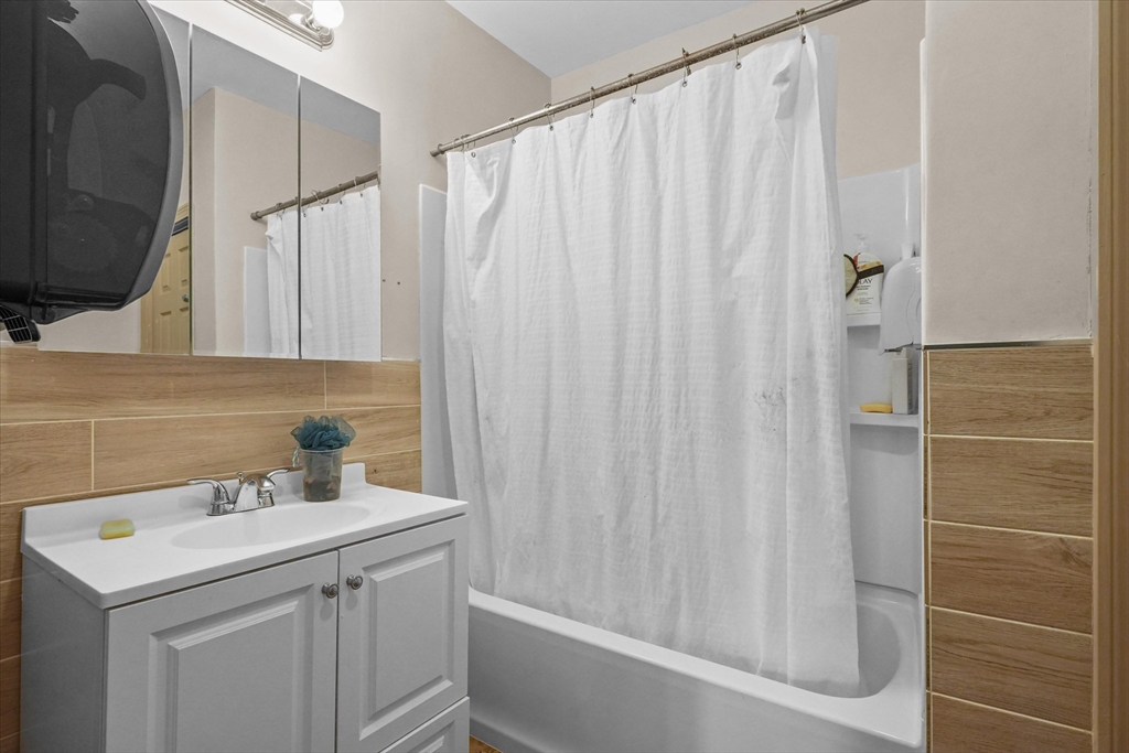 37-39 South Main Street Millbury, MA 01527 - Photo 26 of 42 a bathroom with a sink a toilet and shower