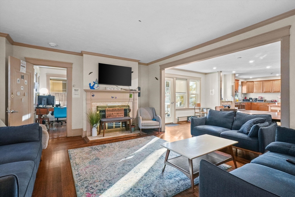 37-39 South Main Street Millbury, MA 01527 - Photo 8 of 42 a living room with furniture a flat screen tv and a fireplace