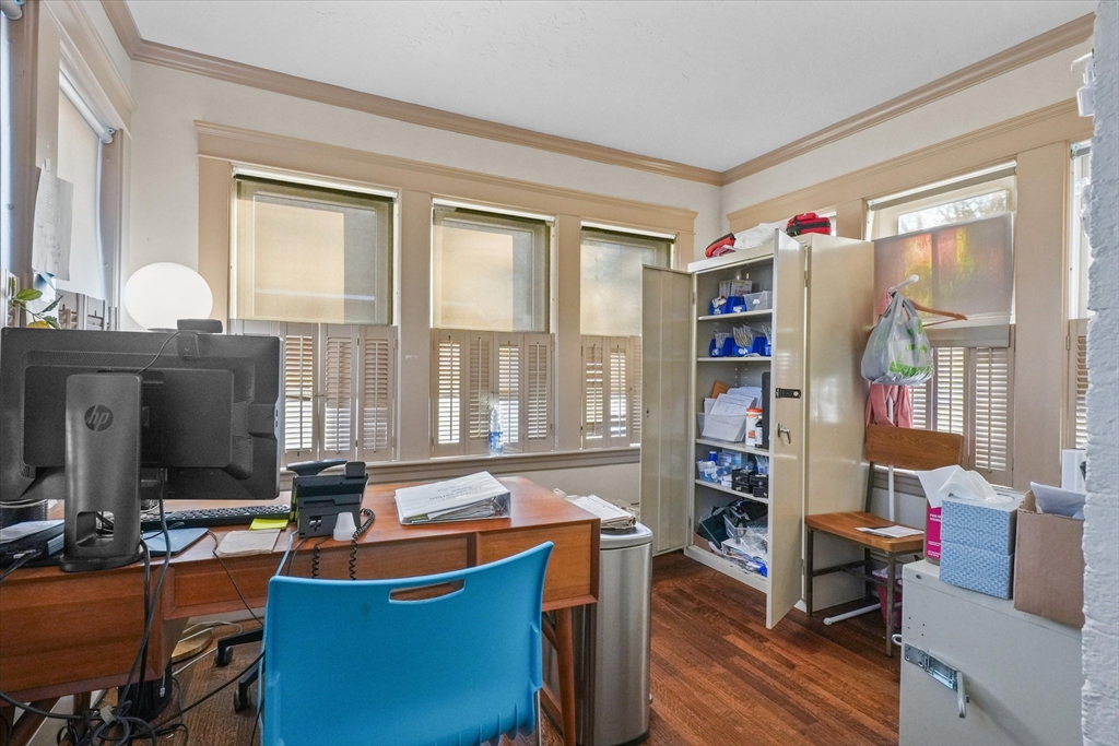 37-39 South Main Street Millbury, MA 01527 - Photo 9 of 42 a room with furniture a bookshelf and a window