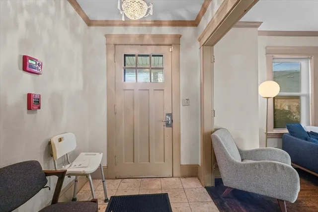 a view of a livingroom with furniture and a window