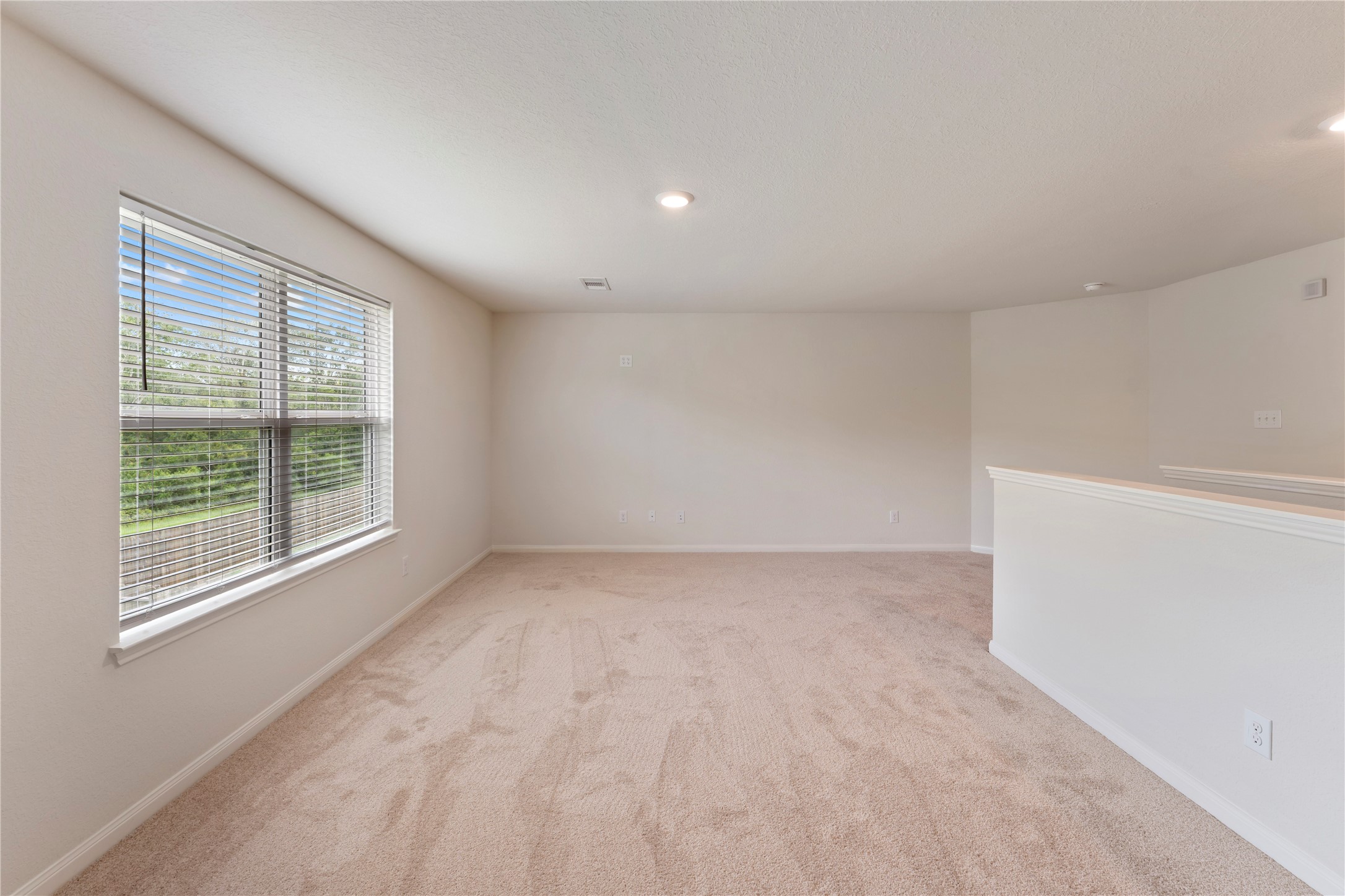 9702 Opal Gates Drive Rosharon, TX 77583 - Photo 29 of 43 a view of an empty room with a window