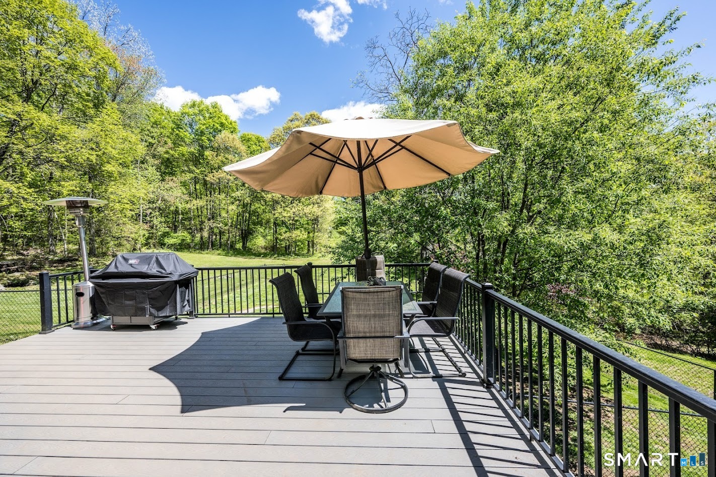 394 Brainard Hill Road Haddam, CT 06441 - Photo 3 of 23 a view of balcony with wooden floor and outdoor seating