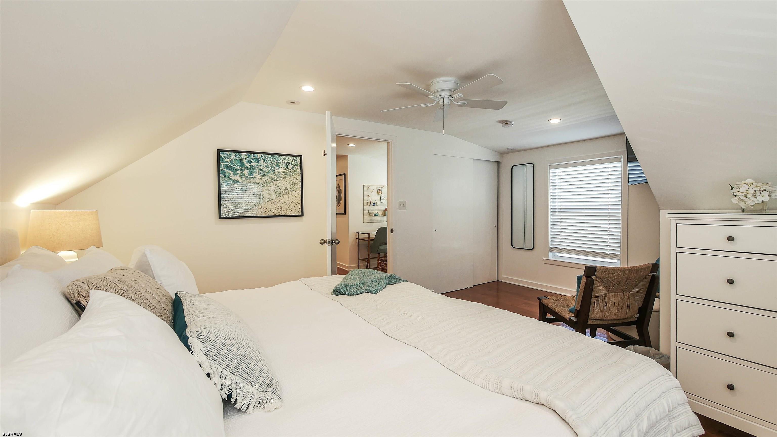 12 North Delavan Avenue, Unit AUGUST 1ST LABOR DAY 2026 Margate City, NJ 08402 - Photo 26 of 41 a bedroom with a bed and a dresser