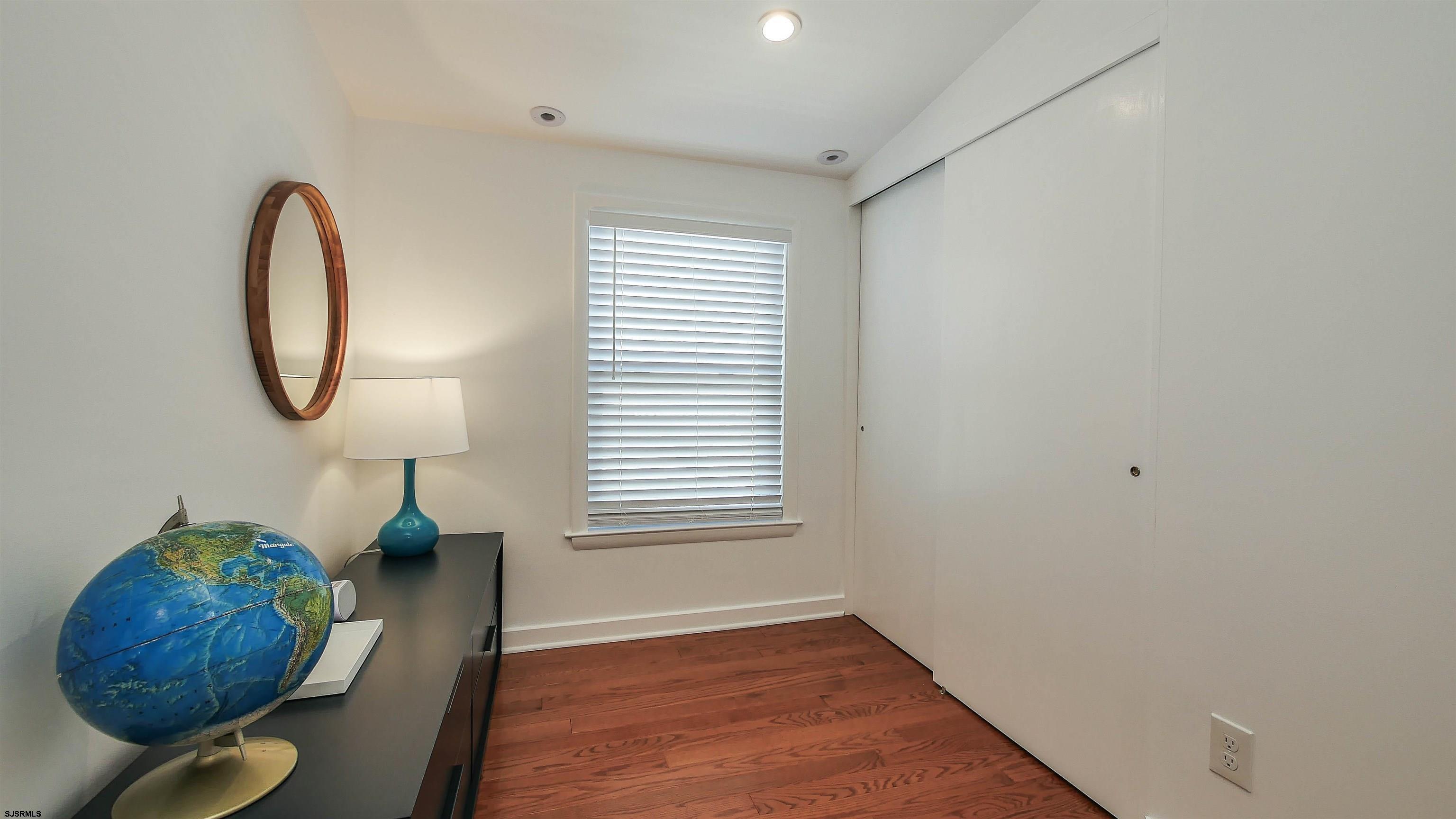 12 North Delavan Avenue, Unit AUGUST 1ST LABOR DAY 2026 Margate City, NJ 08402 - Photo 30 of 41 a room with furniture and a window