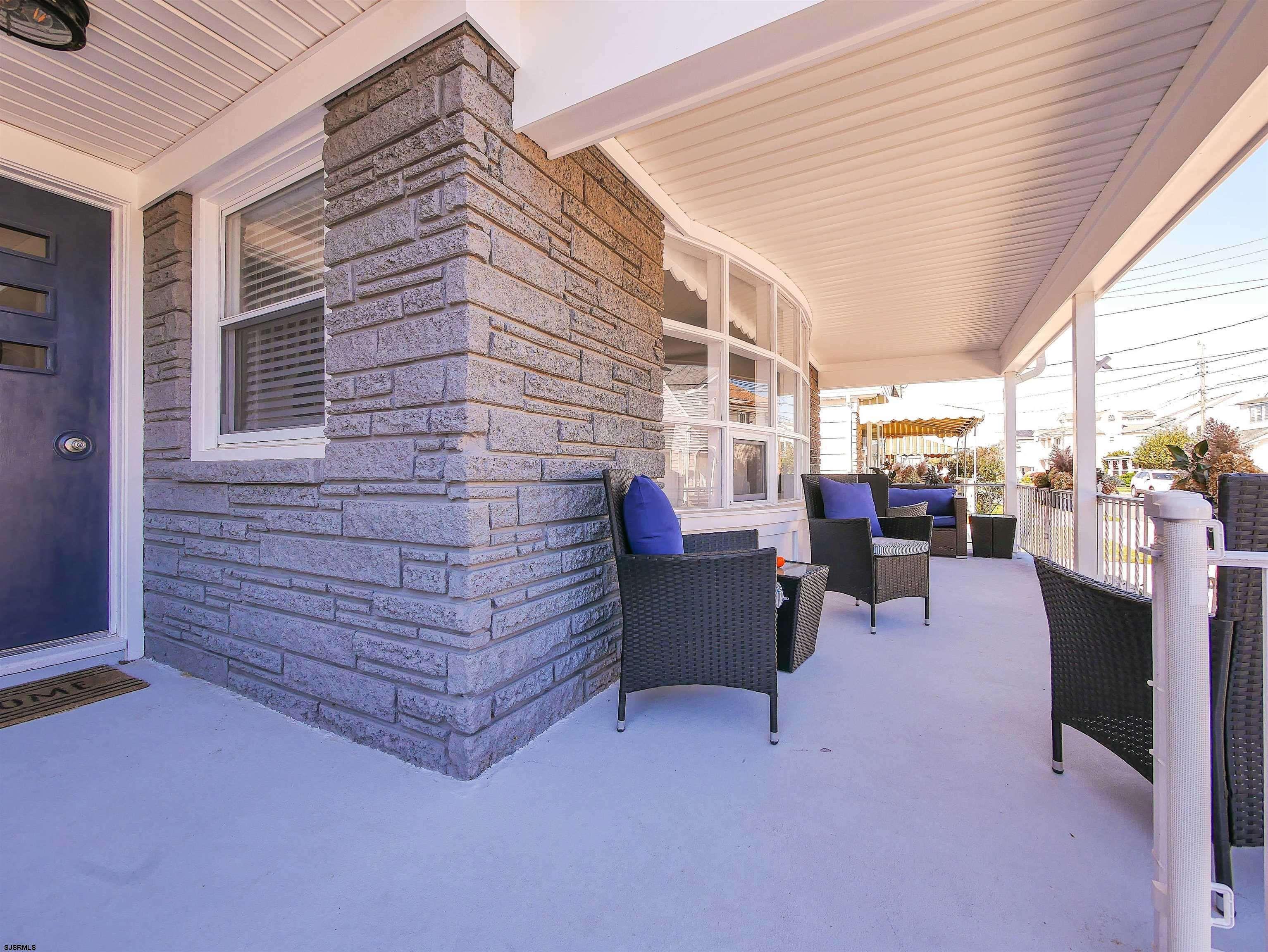 12 North Delavan Avenue, Unit AUGUST 1ST LABOR DAY 2026 Margate City, NJ 08402 - Photo 33 of 41 a brick building with a bench in front of it