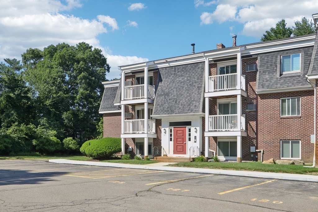 51 Will Drive, Unit 127 Canton, MA 02021 - Photo 13 of 15 a front view of a building with street