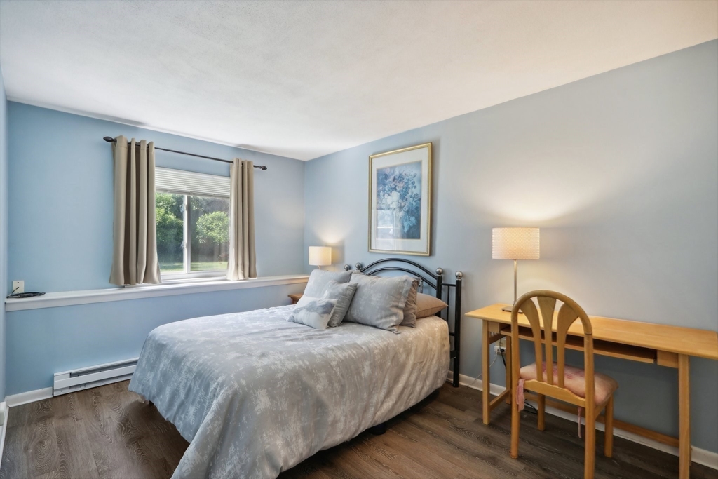 51 Will Drive, Unit 127 Canton, MA 02021 - Photo 9 of 15 a bedroom with a bed and a window