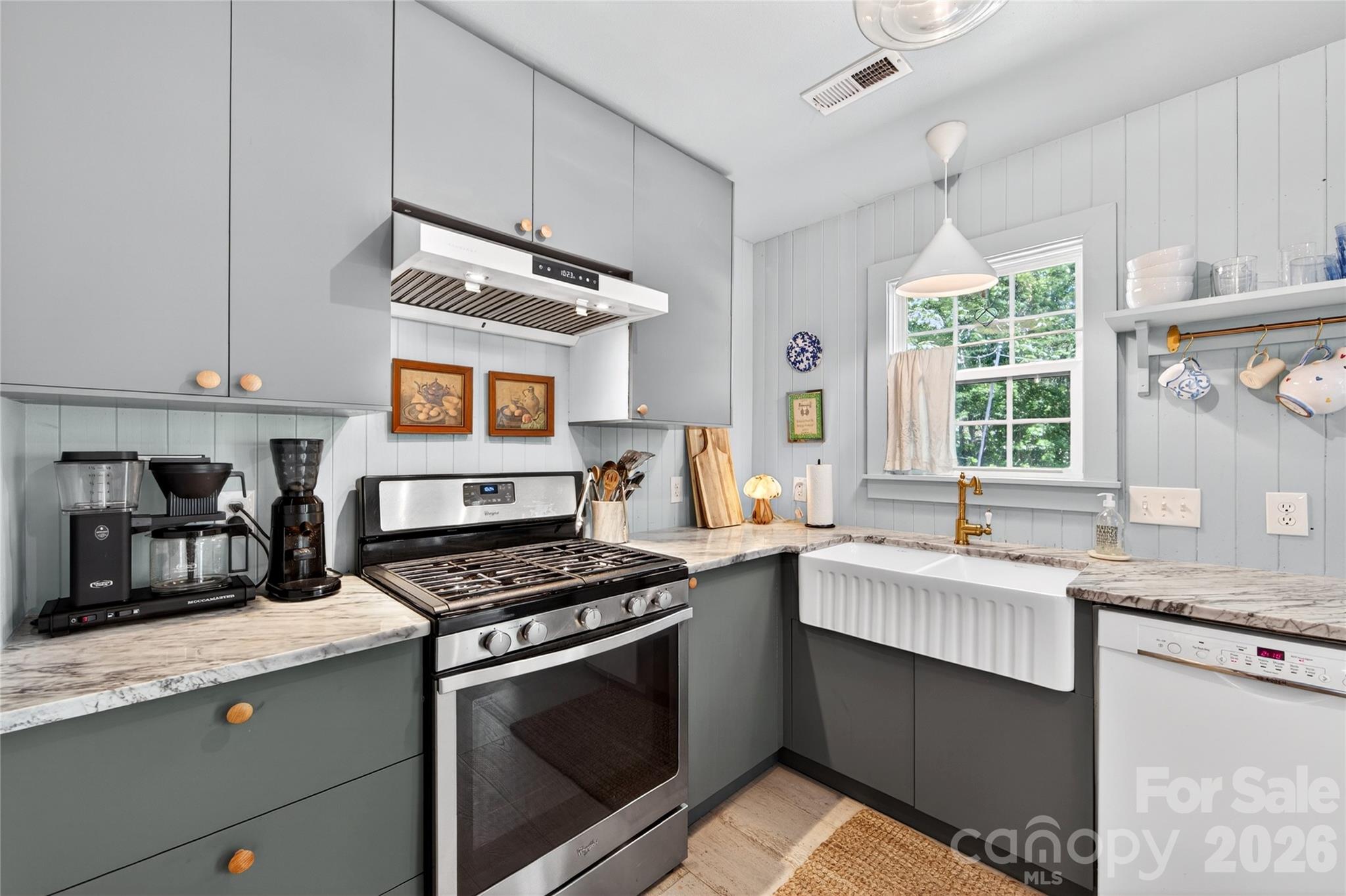 8713 Golf Ridge Drive Charlotte, NC 28277 - Photo 12 of 30 a kitchen with granite countertop a stove sink and cabinets