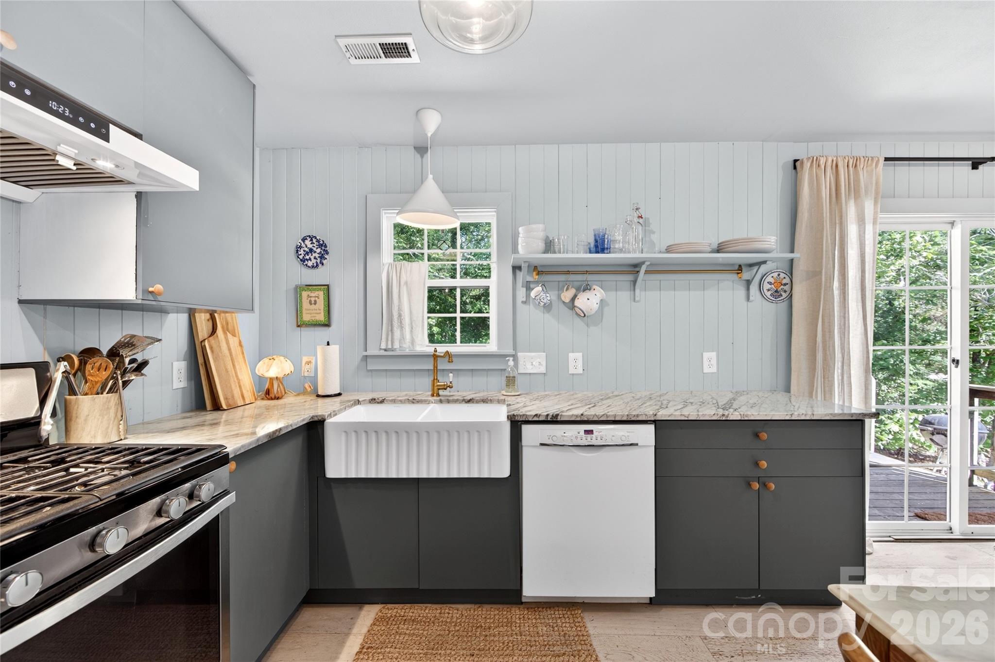 8713 Golf Ridge Drive Charlotte, NC 28277 - Photo 13 of 30 a kitchen with a sink stove and cabinets