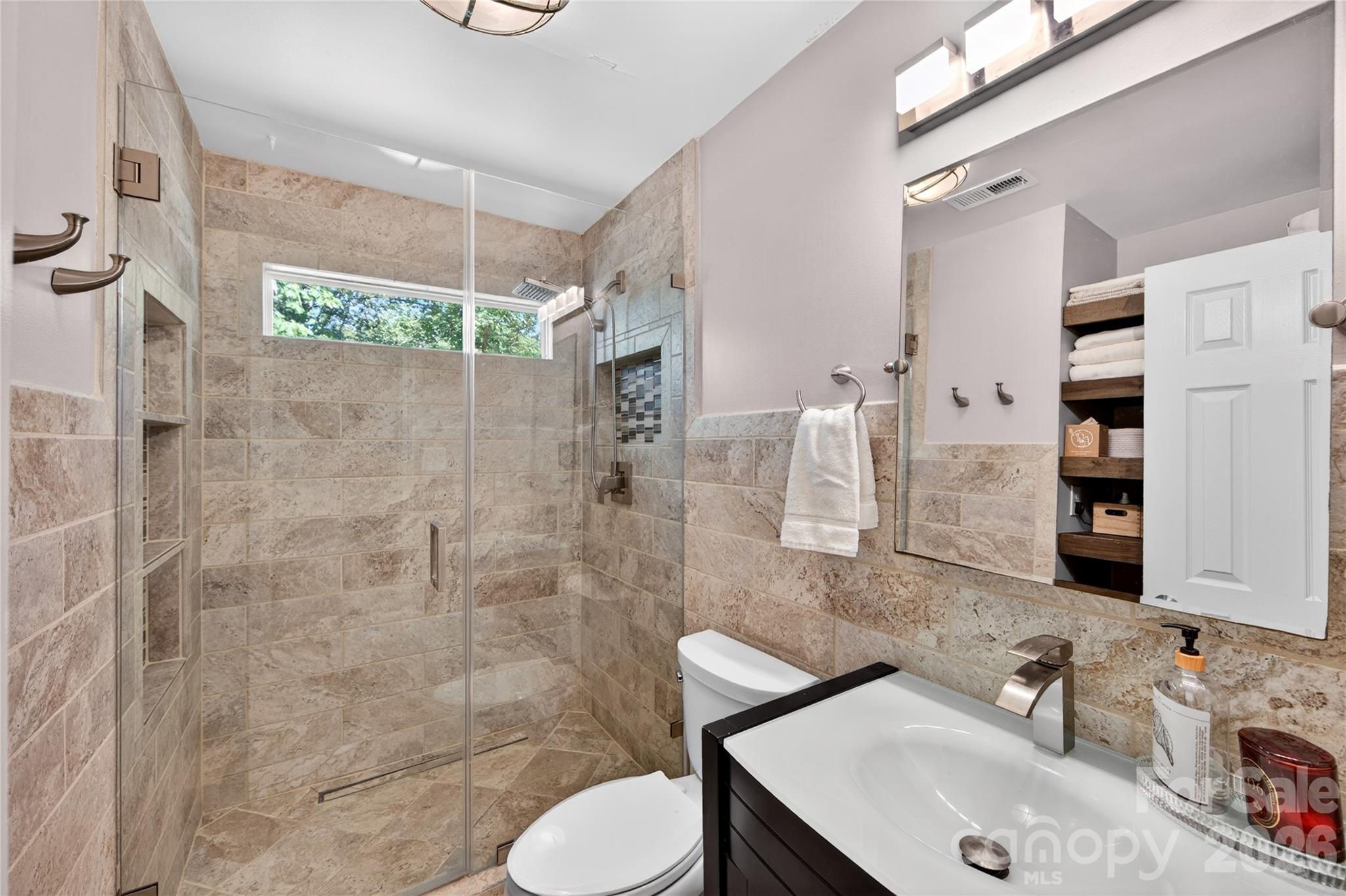 8713 Golf Ridge Drive Charlotte, NC 28277 - Photo 14 of 30 a bathroom with a sink toilet and shower