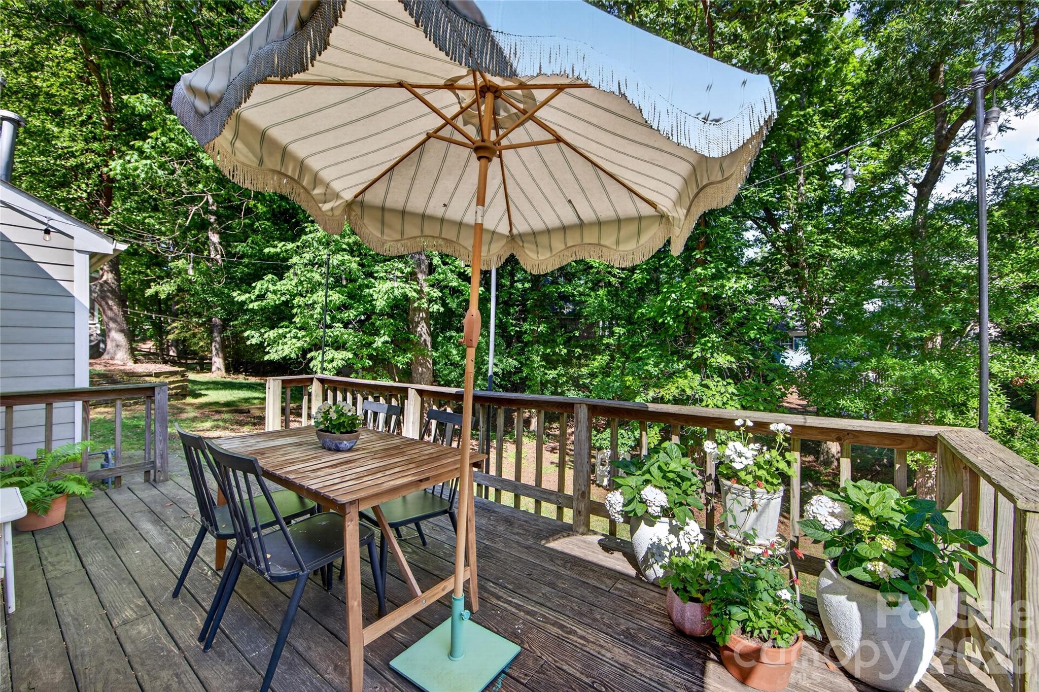 8713 Golf Ridge Drive Charlotte, NC 28277 - Photo 24 of 30 a view of balcony with furniture and umbrella
