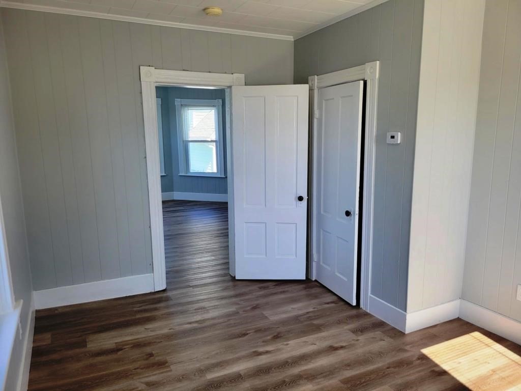 73 1/2 Esther Street, Unit 3 Worcester, MA 01607 - Photo 11 of 22 an empty room with wooden floor and closet