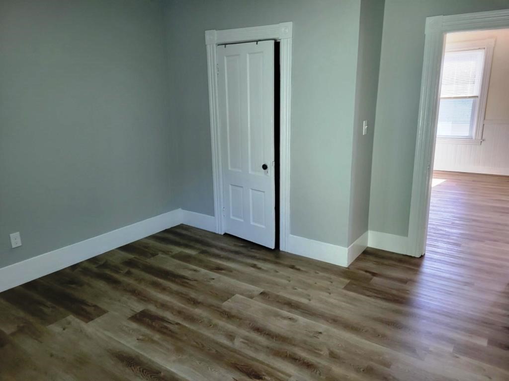 73 1/2 Esther Street, Unit 3 Worcester, MA 01607 - Photo 12 of 22 a view of a room with wooden floor and a window