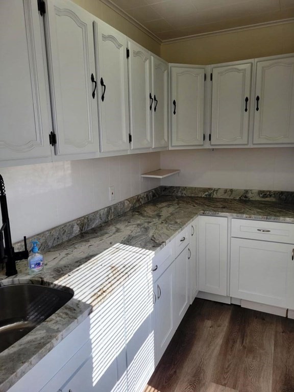 73 1/2 Esther Street, Unit 3 Worcester, MA 01607 - Photo 15 of 22 a kitchen with granite countertop white cabinets and a stove
