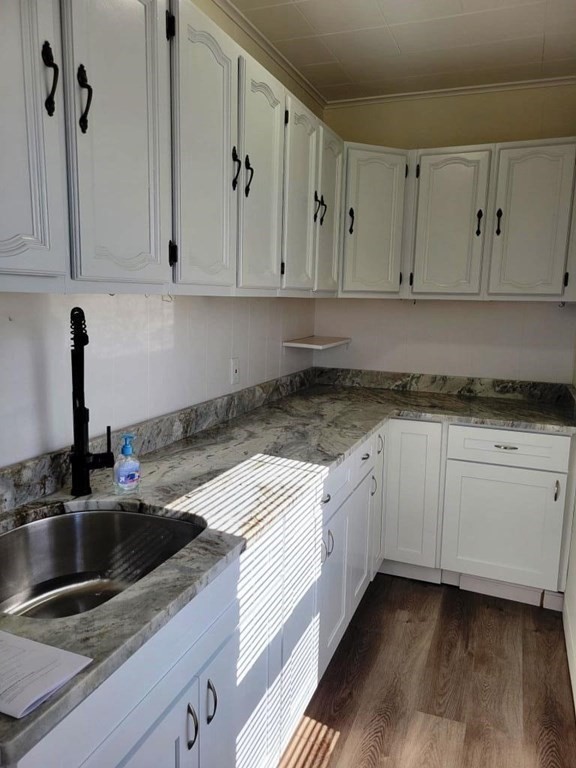 73 1/2 Esther Street, Unit 3 Worcester, MA 01607 - Photo 16 of 22 a kitchen with granite countertop a sink a stove and cabinets