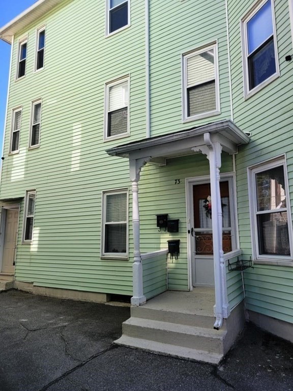73 1/2 Esther Street, Unit 3 Worcester, MA 01607 - Photo 20 of 22 a view of a house with more windows and brick wall