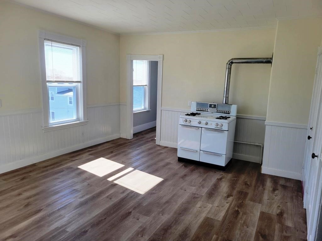 73 1/2 Esther Street, Unit 3 Worcester, MA 01607 - Photo 4 of 22 a living room with furniture and wooden floor