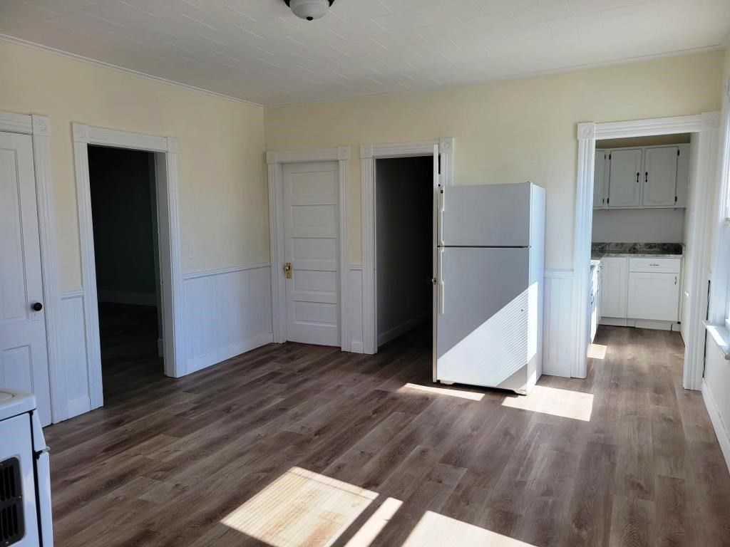 73 1/2 Esther Street, Unit 3 Worcester, MA 01607 - Photo 6 of 22 a view of empty room with wooden floor