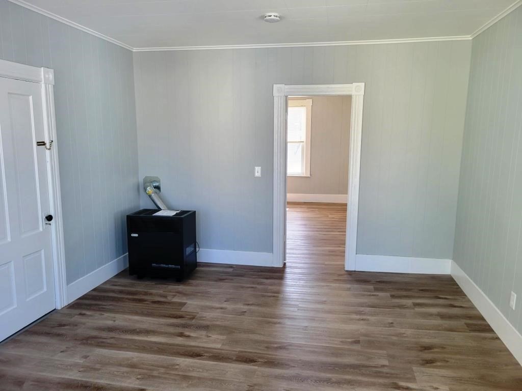 73 1/2 Esther Street, Unit 3 Worcester, MA 01607 - Photo 9 of 22 a view of a bedroom with wooden floor