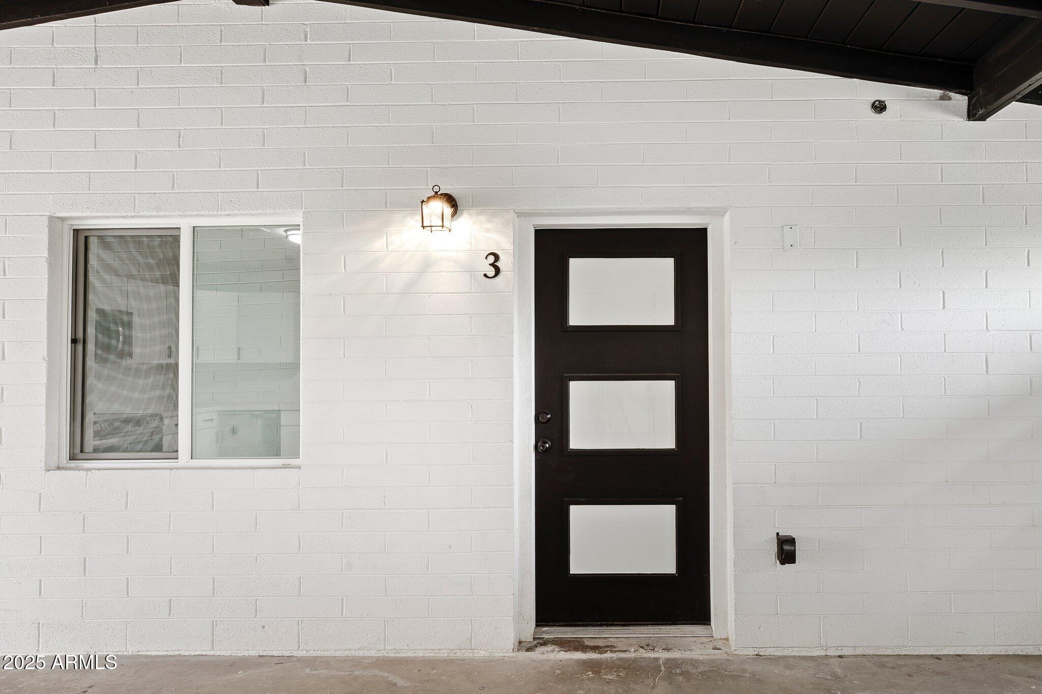 3114 North 68th Street, Unit 2 Scottsdale, AZ 85251 - Photo 11 of 25 a front view of a house with a window