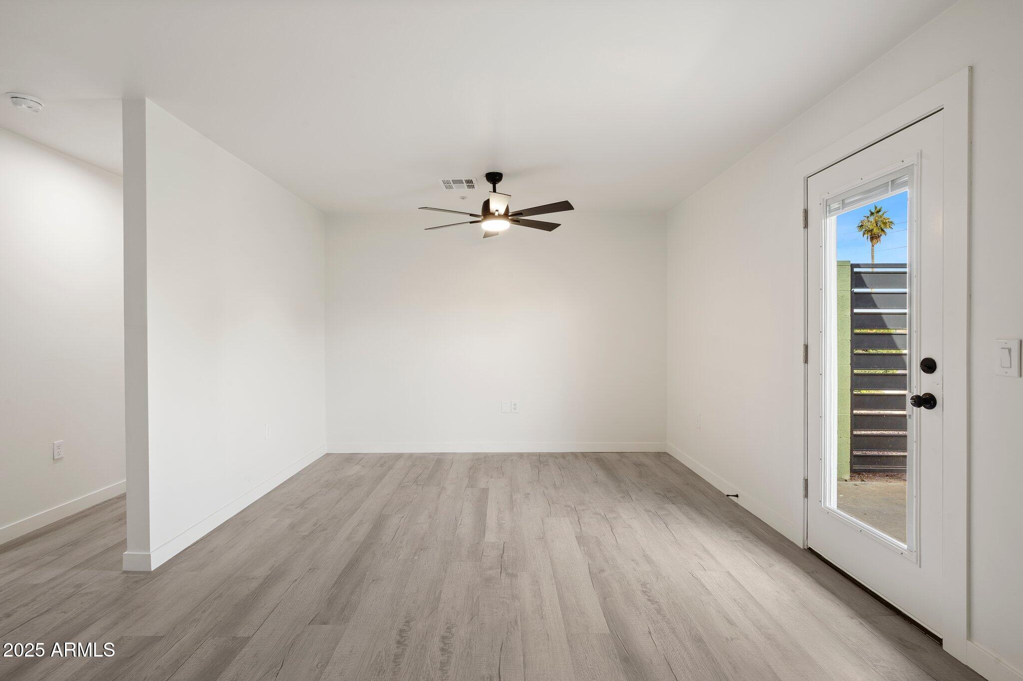 3114 North 68th Street, Unit 2 Scottsdale, AZ 85251 - Photo 19 of 25 wooden floor in an empty room