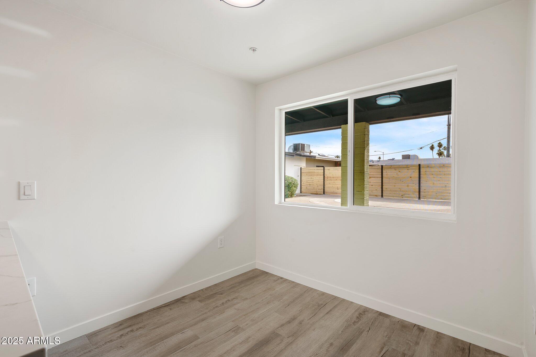 3114 North 68th Street, Unit 2 Scottsdale, AZ 85251 - Photo 23 of 25 an empty room with a window