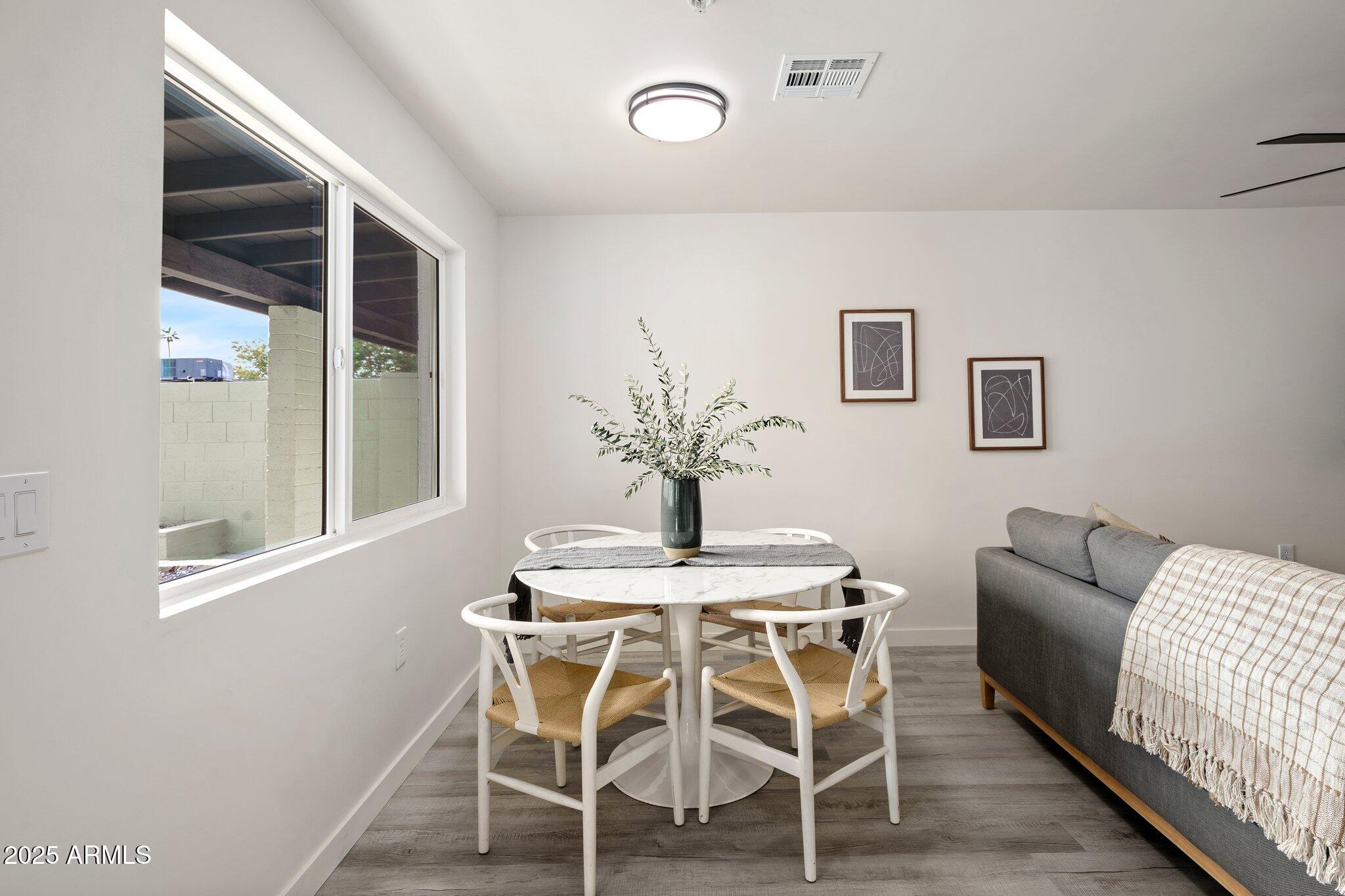 3114 North 68th Street, Unit 2 Scottsdale, AZ 85251 - Photo 5 of 25 a dining room with furniture and window