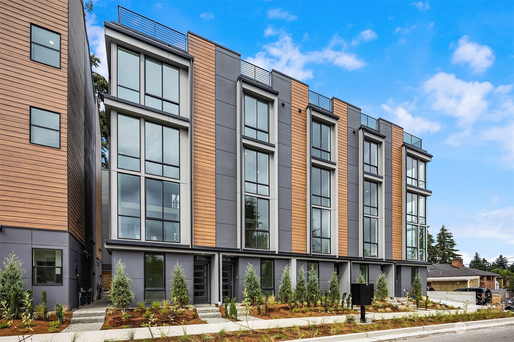 3112 Northeast 120th Street Seattle, WA 98125 - Photo 1 of 26 a front view of a building with street