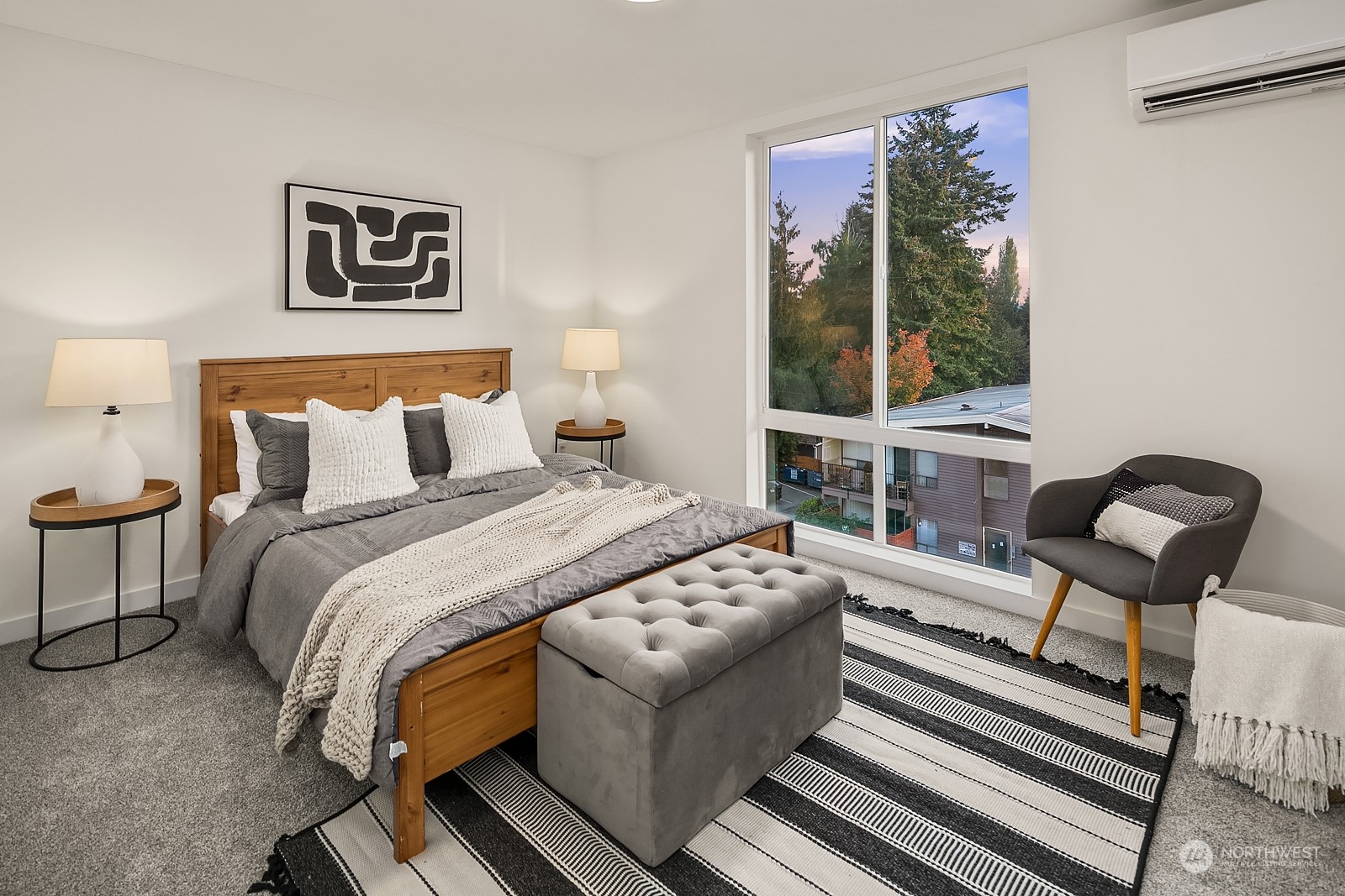 3112 Northeast 120th Street Seattle, WA 98125 - Photo 14 of 26 a bedroom with a bed and a large window with outer view