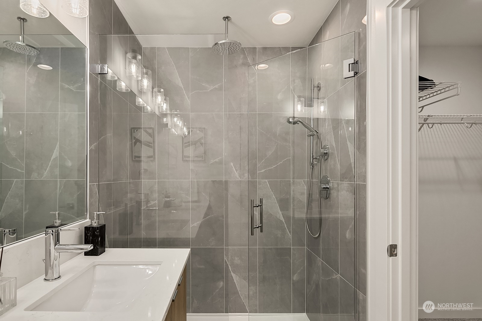 3112 Northeast 120th Street Seattle, WA 98125 - Photo 16 of 26 a bathroom with a shower and a sink