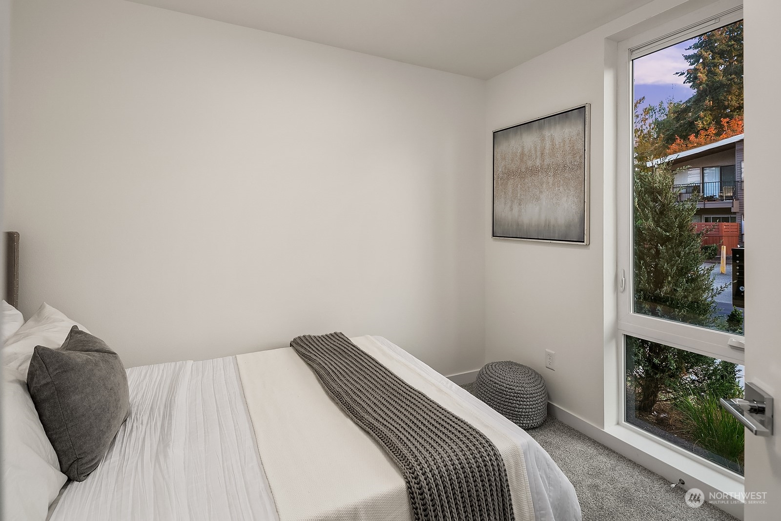 3112 Northeast 120th Street Seattle, WA 98125 - Photo 18 of 26 a bedroom with a bed and a painting on the wall