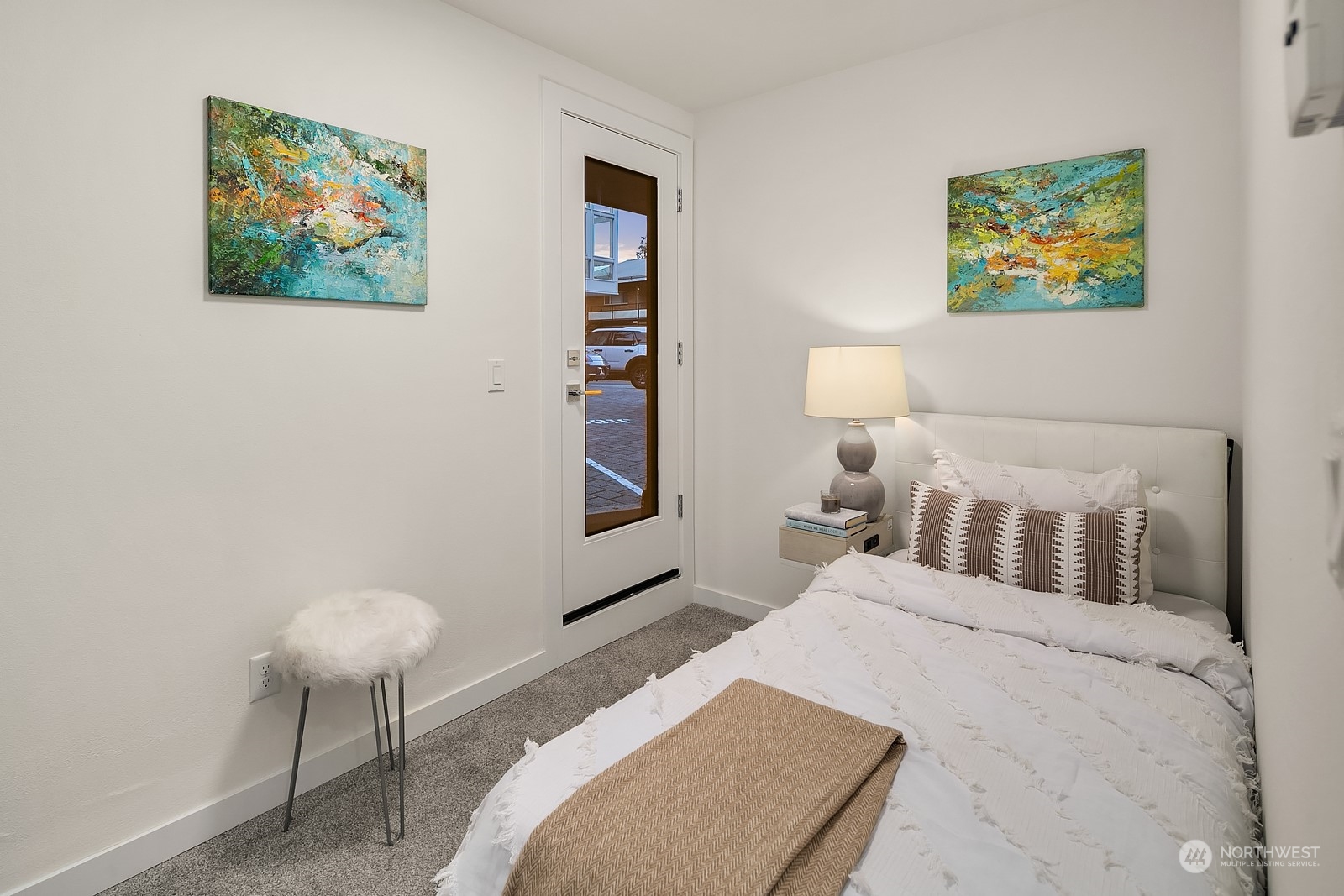 3112 Northeast 120th Street Seattle, WA 98125 - Photo 19 of 26 a bedroom with a bed and a painting on the wall