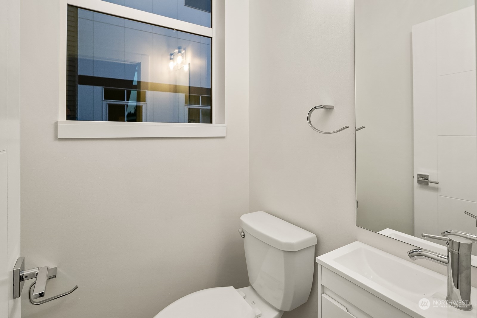 3112 Northeast 120th Street Seattle, WA 98125 - Photo 20 of 26 a white toilet sitting next to a bathroom sink