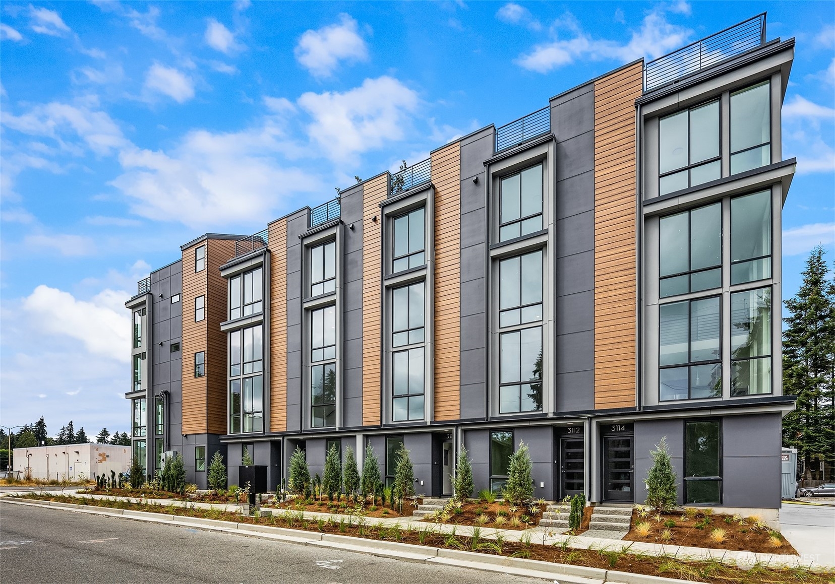 3112 Northeast 120th Street Seattle, WA 98125 - Photo 24 of 26 a front view of a building with a street