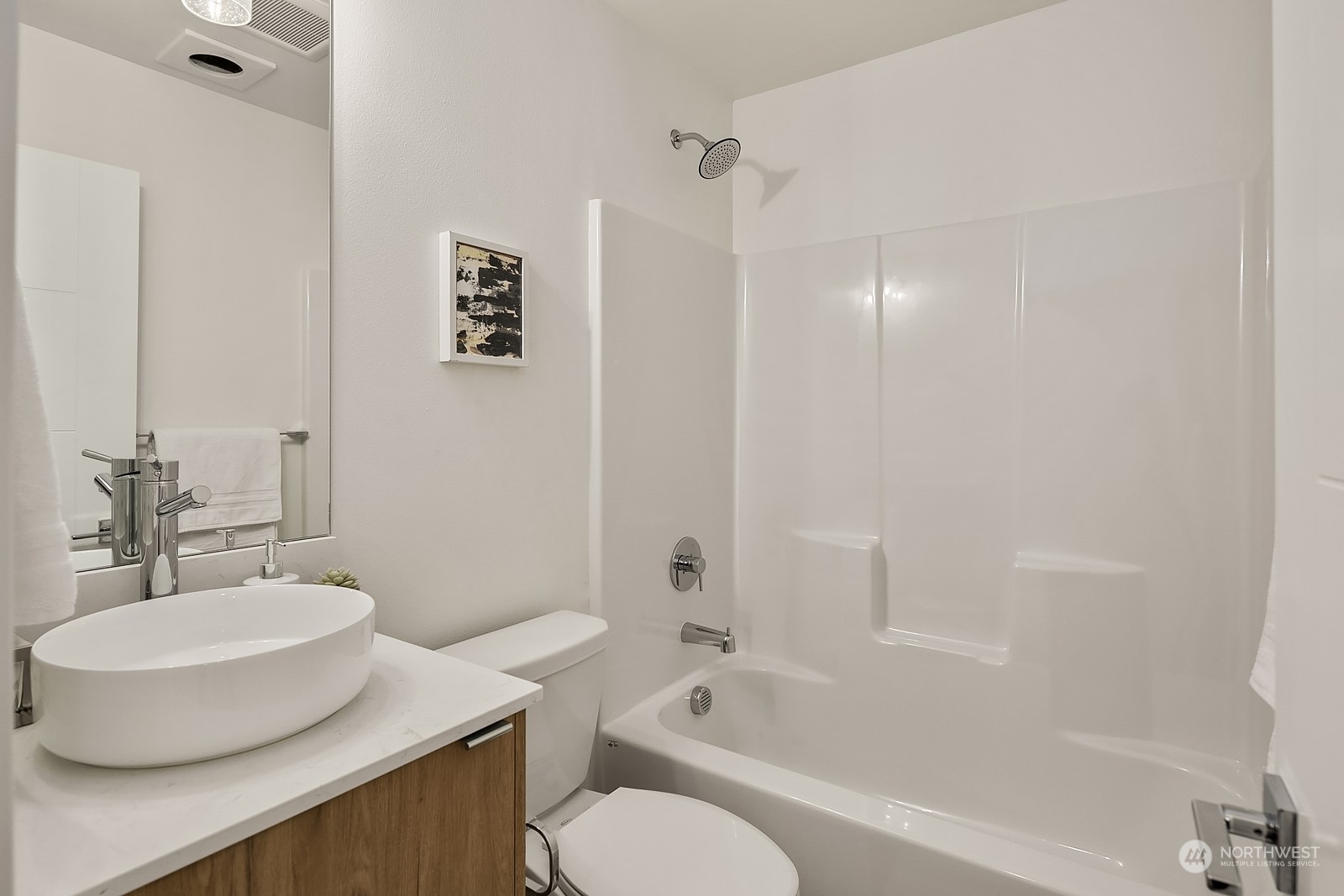 3112 Northeast 120th Street Seattle, WA 98125 - Photo 8 of 26 a bathroom with a bathtub shower sink and a toilet