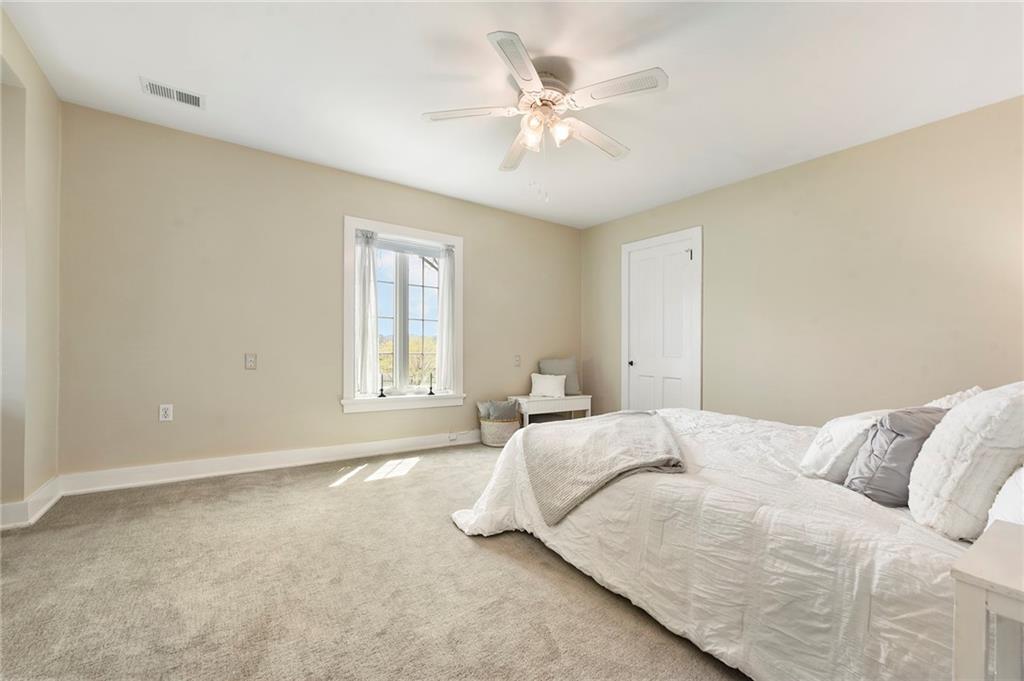 637 East McMurray Road Canonsburg, PA 15317 - Photo 27 of 50 a bedroom with a large bed and a ceiling fan