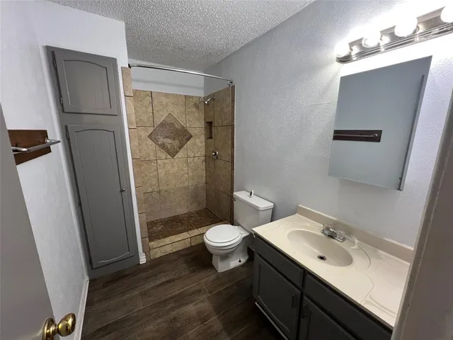 a front view of house with yard and trees