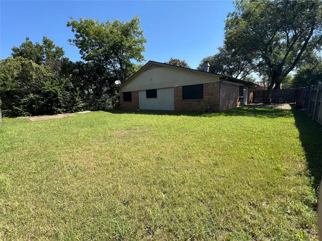 a view of the house with backyard