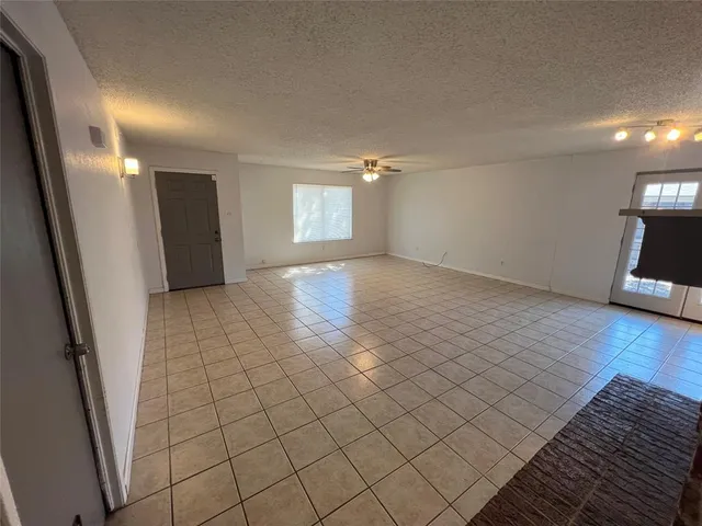 a kitchen with a sink a stove and cabinets