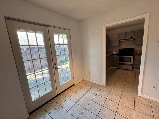 a kitchen with stainless steel appliances a sink and cabinets