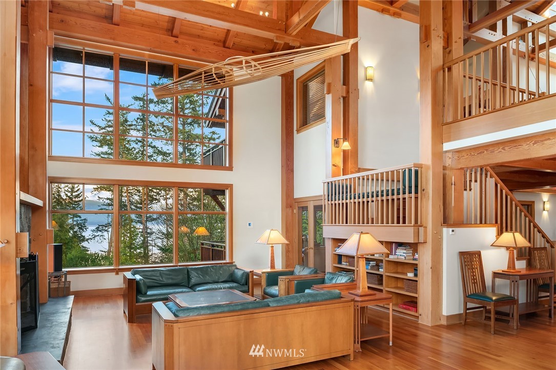 4129 Point Williams Place Bow, WA 98232 - Photo 14 of 40 a living room with large windows and wooden floor