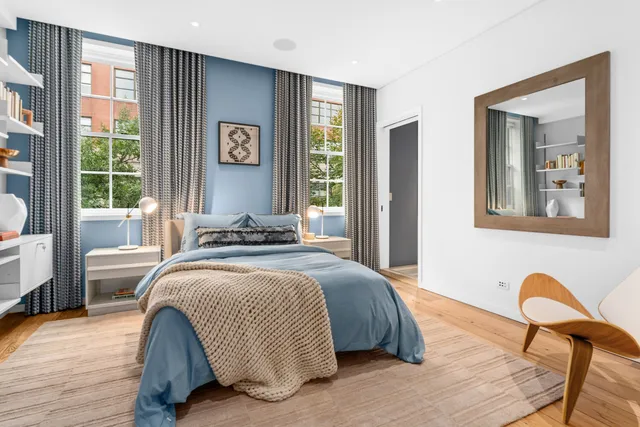 a view of a chairs and table in the balcony